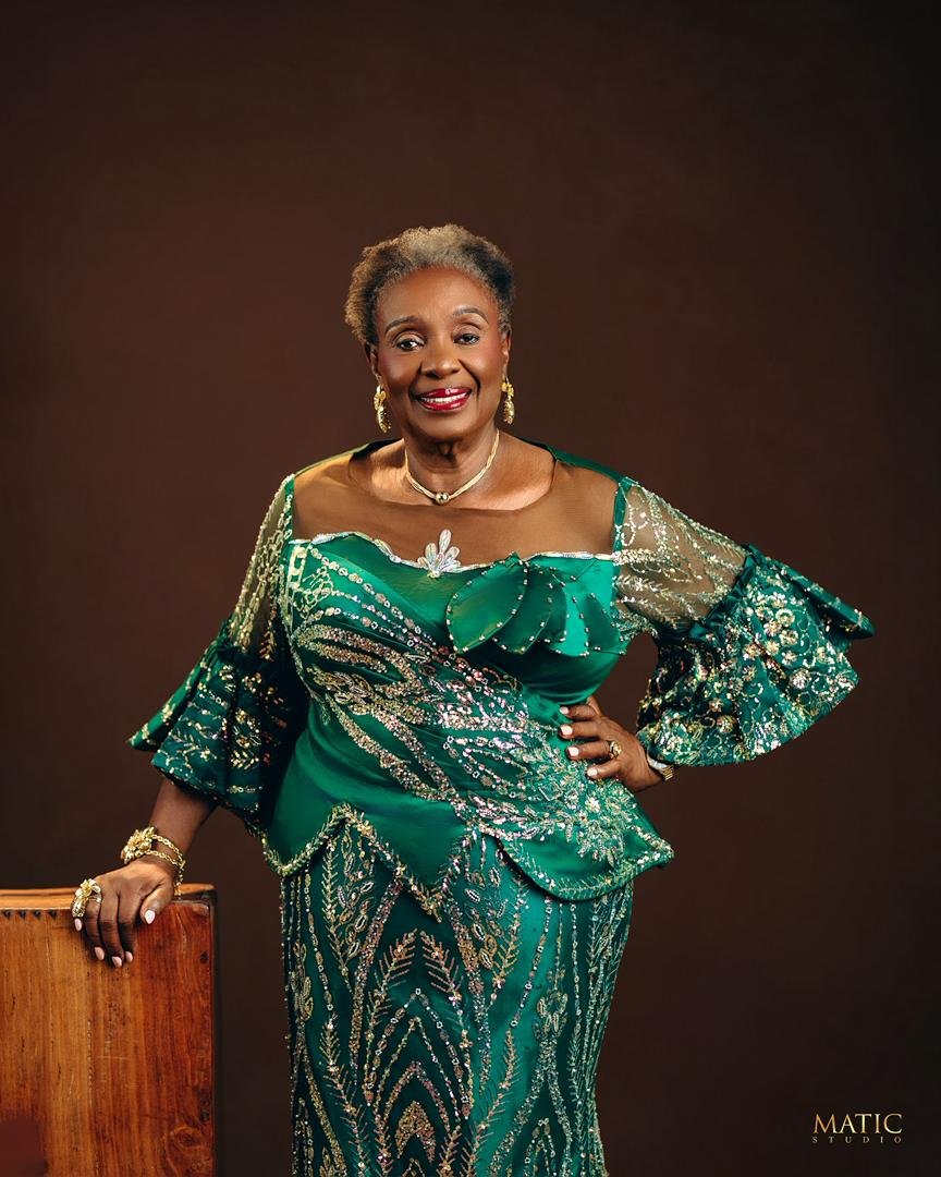 Chief Mrs. Josephine Chinyelu Nwosu in an elegant emerald green outfit.
